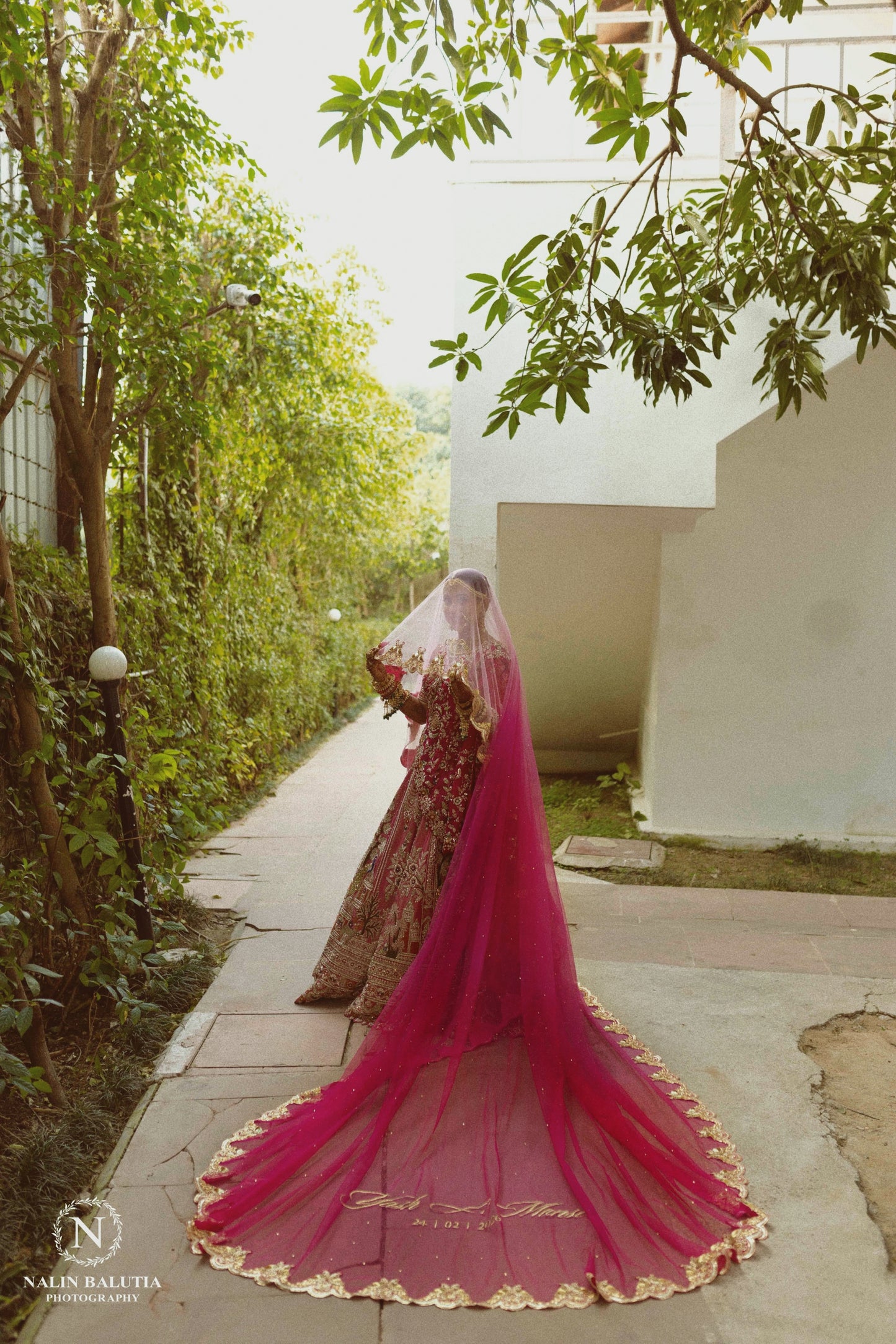 Peonique : A cathedral-length veil in a soft ombré pink, beaded peacock-inspired border