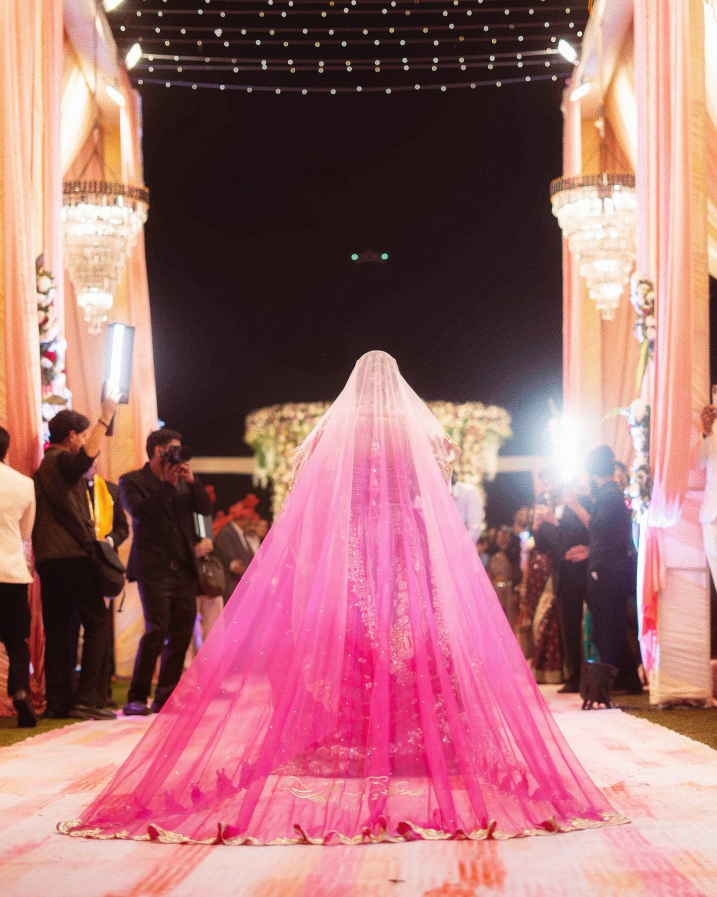 Peonique : A cathedral-length veil in a soft ombré pink, beaded peacock-inspired border