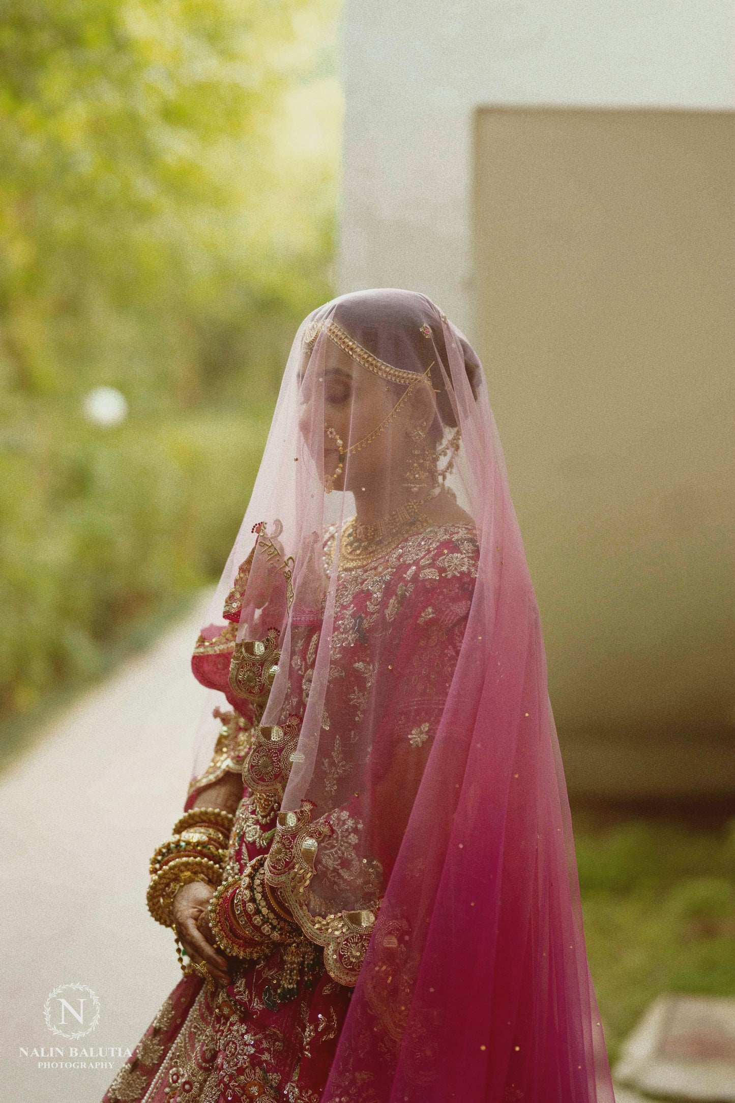 Peonique : A cathedral-length veil in a soft ombré pink, beaded peacock-inspired border