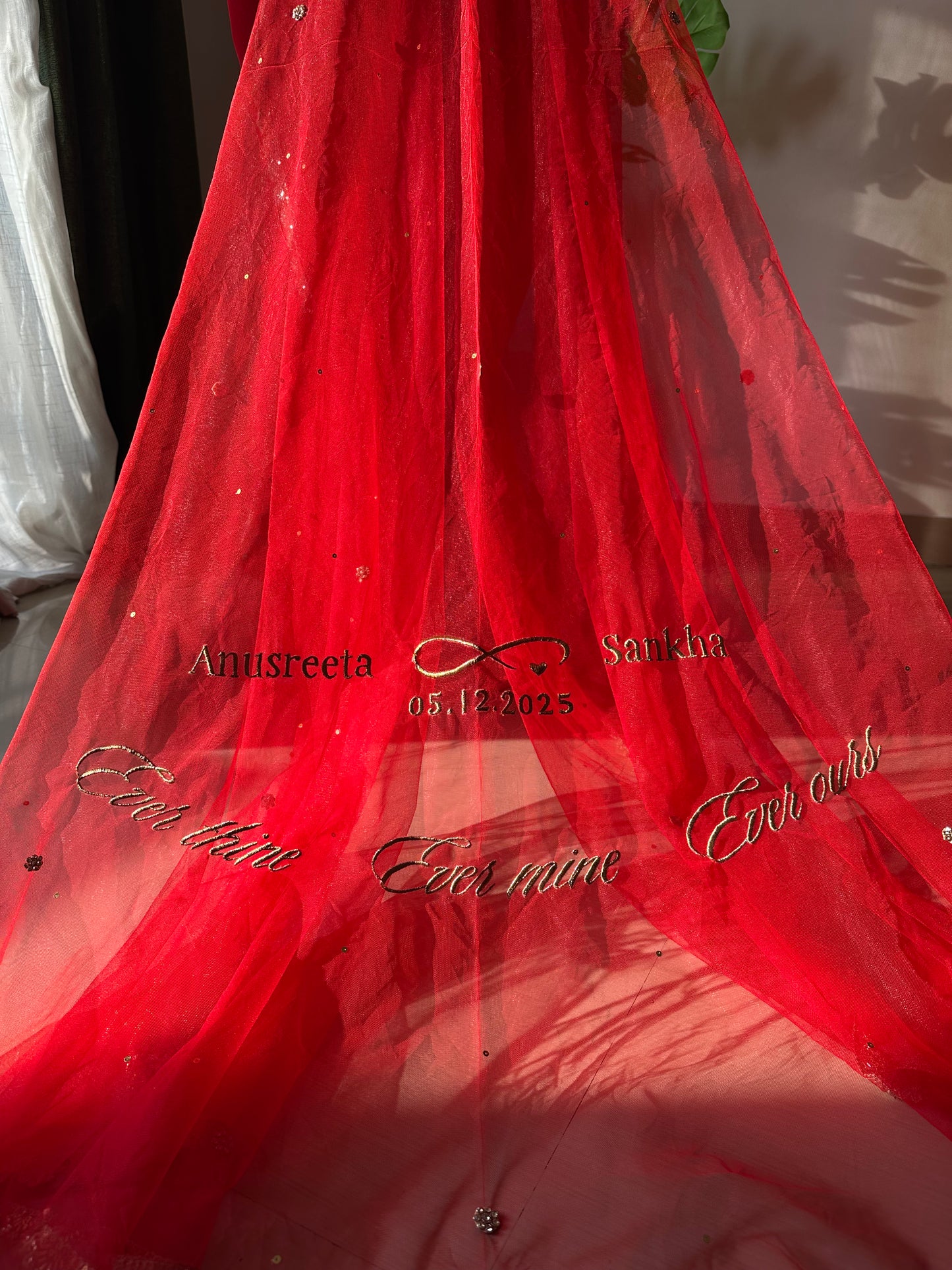 Anusreeta : Red Cathedral length Veil with Couple's name with infinity symbol ; wedding date & a quote