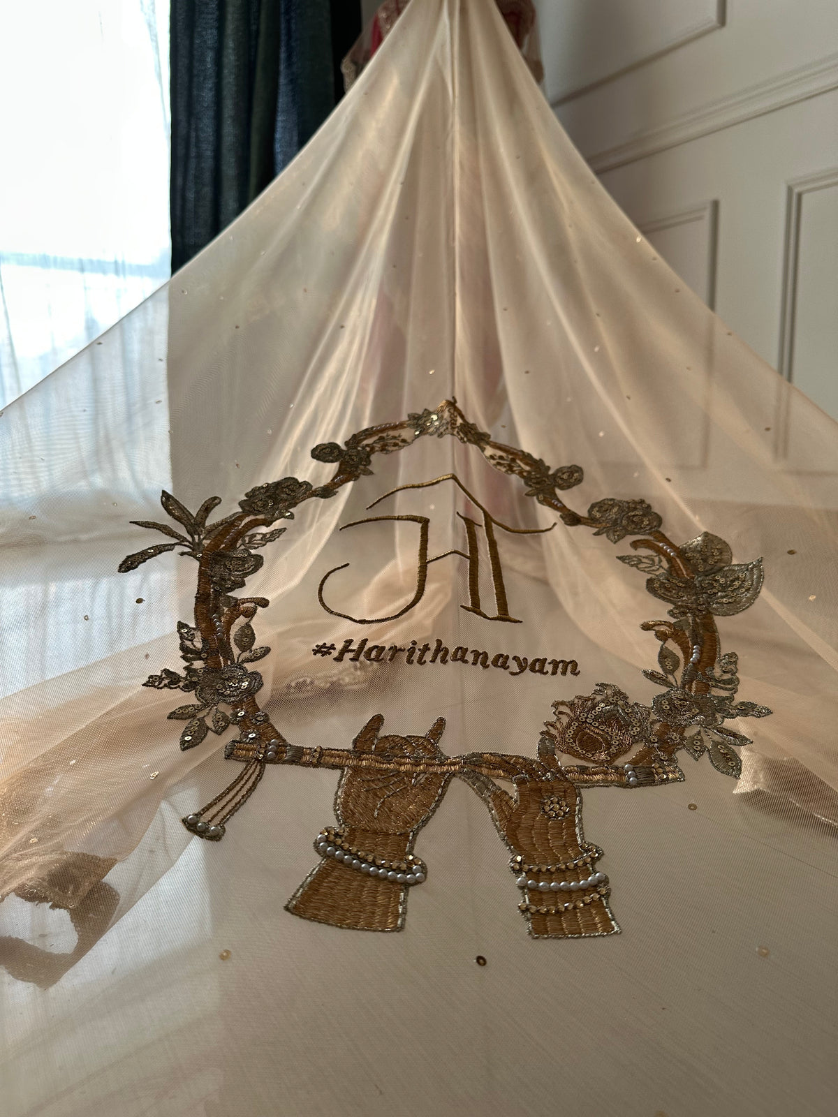 Radhika : Raadha-Krishna inspired Wedding Logo for a Cathedral length Veil