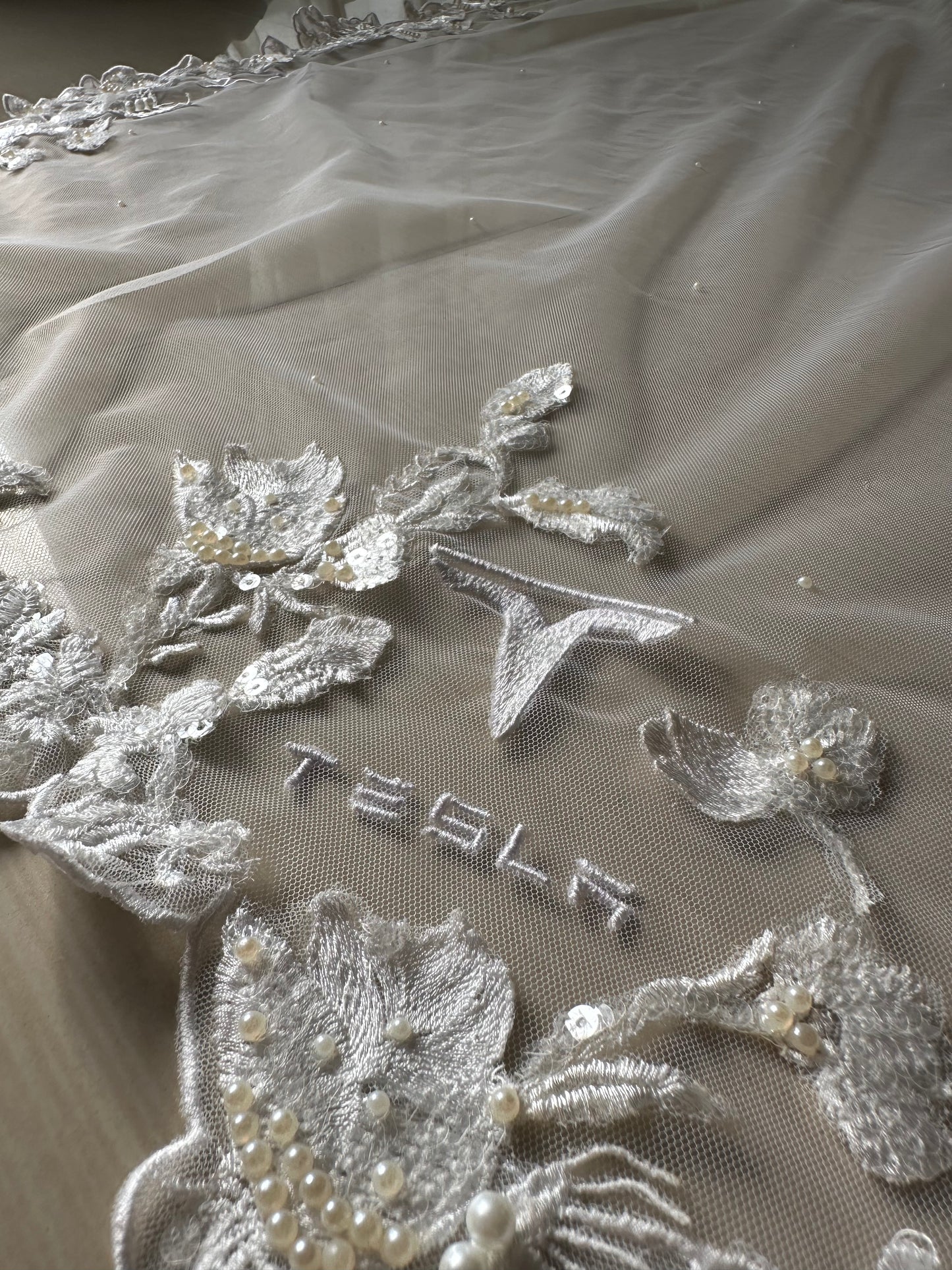 The Love Story Veil : White Cathedral Petal Cut custom hand embroidered floral veil with love story personalisation