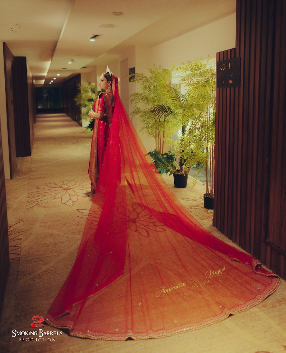Agni : A Sabyasachi inspired border work with couple's name on cathedral length veil