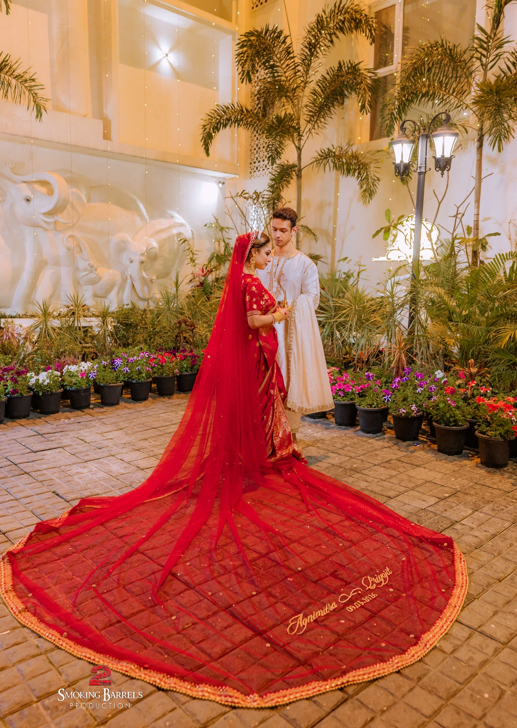 Agni : A Sabyasachi inspired border work with couple's name on cathedral length veil
