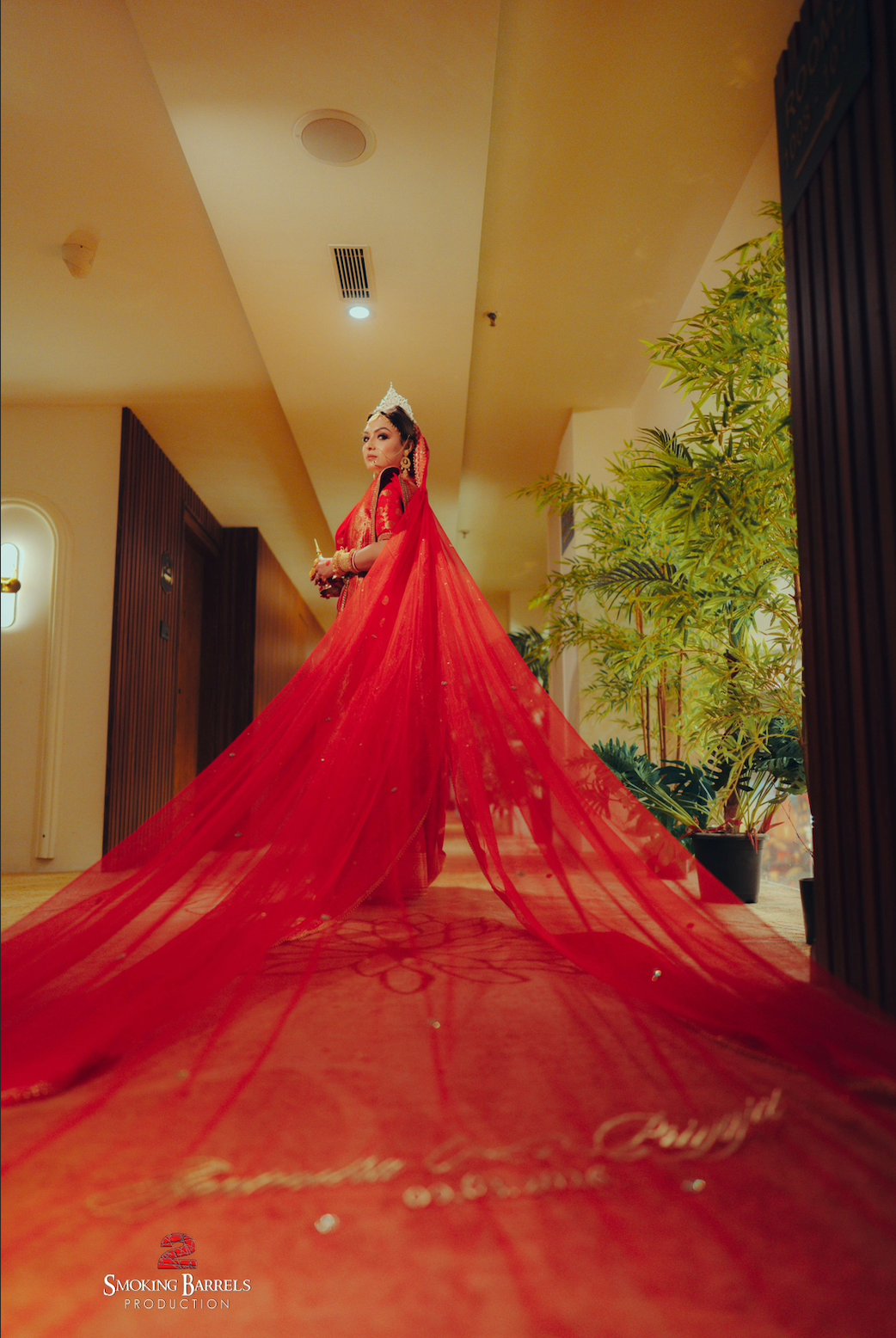 Agni : A Sabyasachi inspired border work with couple's name on cathedral length veil