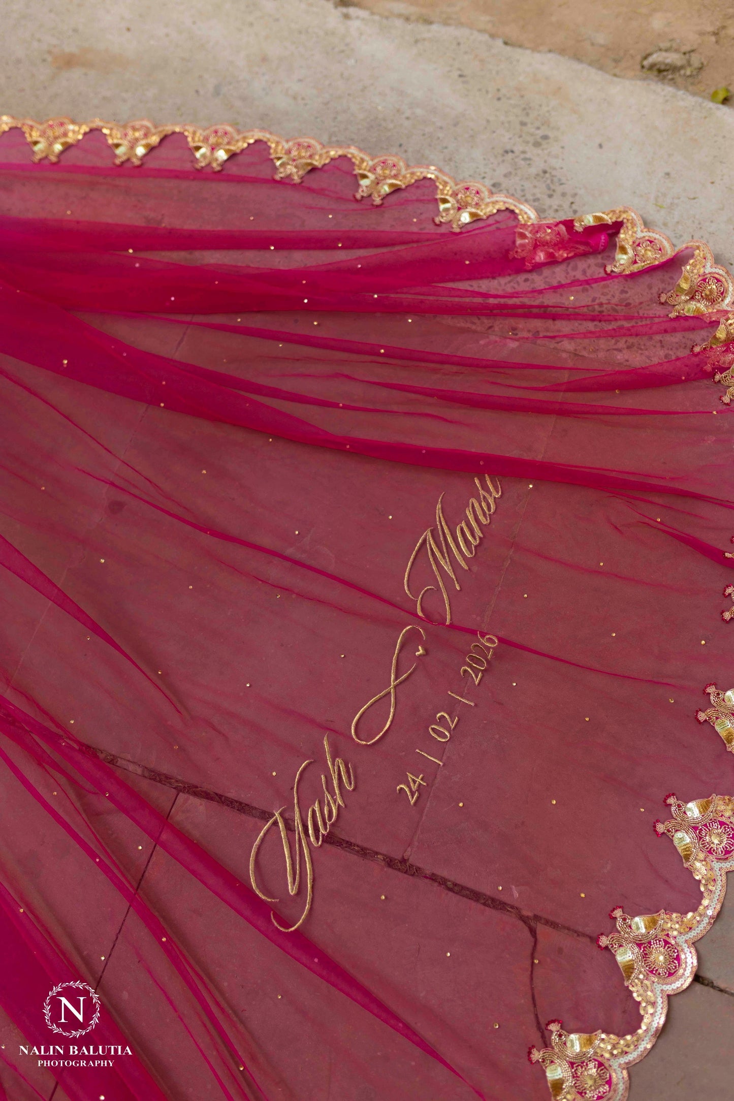 Peonique : A cathedral-length veil in a soft ombré pink, beaded peacock-inspired border